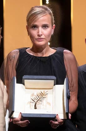July 17, 2021, Julia Ducournau pose with the Palme d Or Best Movie Award for Titane at the closing ceremony during the 74th Annual Cannes Film Festival at Palais des Festivals in Cannes, France, on 17 July 2021. Photo: - ZUMAm179 20210717_zep_m179_076 Copyright: xAlecxMichaelx