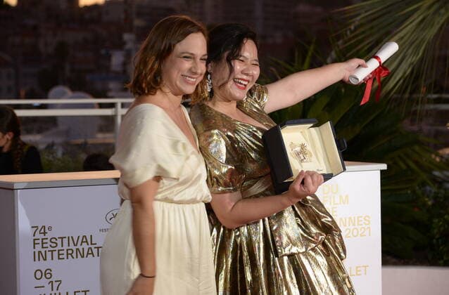 July 17, 2021, CANNES, France: CANNES, FRANCE - JULY 17: Tang Yi and Lasmin Tenucci pose with the Best Short Movie Award for Tous les corbeaux du monde during the 74th annual Cannes Film Festival on July 17, 2021 in Cannes, France. CANNES France - ZUMAi09_ 20210717_zaf_i09_007 Copyright: xFrederickxInjimbertx