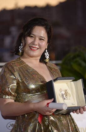 July 17, 2021, CANNES, France: CANNES, FRANCE - JULY 17: Tang Yi poses with the Best Short Movie Award for Tous les corbeaux du monde during the 74th annual Cannes Film Festival on July 17, 2021 in Cannes, France. CANNES France - ZUMAi09_ 20210717_zaf_i09_017 Copyright: xFrederickxInjimbertx
