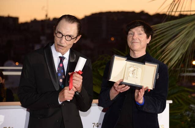 July 17, 2021, CANNES, France: CANNES, FRANCE - JULY 17: Ron Mael and Russell Mael pose with the Best Director Award in the name of Leos Carax for Annette during the 74th annual Cannes Film Festival on July 17, 2021 in Cannes, France CANNES France - ZUMAi09_ 20210717_zaf_i09_035 Copyright: xFrederickxInjimbertx