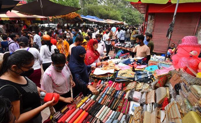 NEW DELHI, INDIA - JULY 18: People flout Covid norms as they shop at Sarojini Nagar market, on July 18, 2021 in New Delhi, India. (Photo by Raj K Raj Hindustan Times) Shoppers Flout Covid Norms In Delhi s Sarojini Market