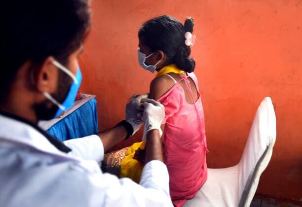 NEW DELHI, INDIA - JULY 18: A beneficiary recieves a dose of Covid-19 vaccine, during a vaccination drive at Satya Jeevan Leprosy Society in Lajpat Nagar, on July 18, 2021 in New Delhi, India. (Photo by Raj K Raj Hindustan Times) COVID-19 Vaccination Drive