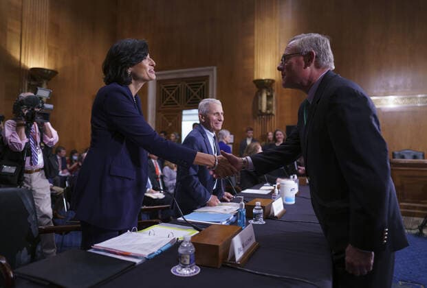 Dr. Rochelle Walensky, left, director of the Centers for Disease Control and Prevention, and top infectious disease expert Dr. Anthony Fauci, center, are greeted by Sen. Richard Burr, R-N.C., to the Senate Health, Education, Labor, and Pensions Committee on Capitol Hill in Washington, Tuesday, July 20, 2021. The health experts are to testify about the latest in the fight against the coronavirus. Pool WAXP20210720101 J.xScottxApplewhite