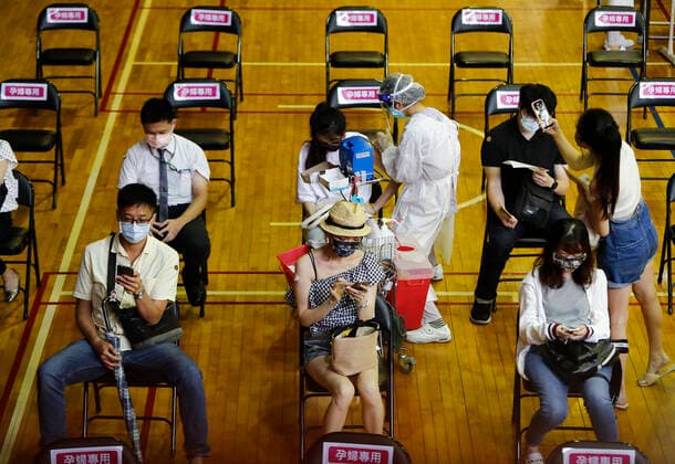 Coronavirus Vaccination In Taiwan People get inoculated with vaccines against the Coronavirus, at a site inside the National Taiwan University Hospital, as the island has seen a downward shift in the number of infections and deaths, in Taipei, Taiwan, 21 July 2021. Taiwan is discussing the possibility of easing more Covid restrictions as it supplies AstraZeneca, Moderna and Mediterranean vaccines to boost immunity rate, with travel and border restrictions remain effective. Taipei Taiwan ceng-notitle210721_npVrS  Copyright: xCengxShouxYix