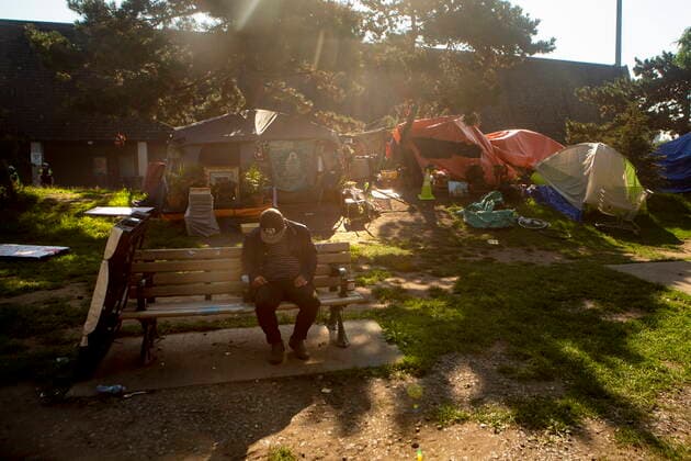 July 21, 2021, Toronto, on, Canada: A man sits on a bench as encampment resident wait for Toronto police and city workers to clear the Lamport Stadium Park homeless encampment in Toronto on Wednesday, July 21, 2021. Toronto Canada  - ZUMAc35_ 20210721_zaf_c35_039 Copyright: xChrisxYoungx