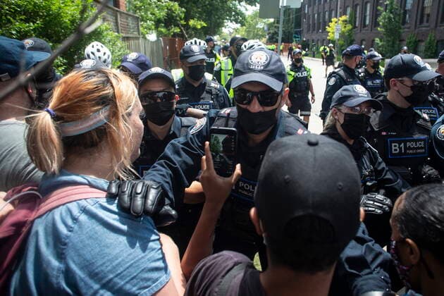 July 21, 2021, Toronto, on, Canada: Toronto police push out encampment supporters as they clear the Lamport Stadium Park homeless encampment in Toronto on Wednesday, July 21, 2021. Toronto Canada  - ZUMAc35_ 20210721_zaf_c35_051 Copyright: xChrisxYoungx