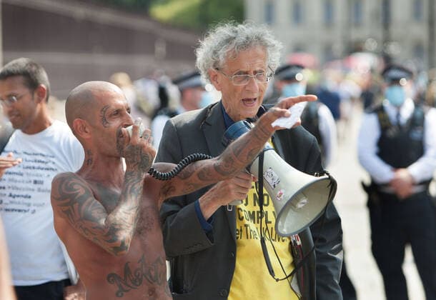 July 21, 2021, London, United Kingdom: Piers Corbyn speaking with a megaphone, during the demonstration..English weather forecaster, businessman, activist, Piers Corbyn with other protesters met outside the House of Commons at Parliament Square to protest against Vaccine passports and other Coronavirus restrictions that he feels the public are being softened up to accept as the new normal. London United Kingdom - ZUMAs197 20210721_zaa_s197_205 Copyright: xMartinxPopex