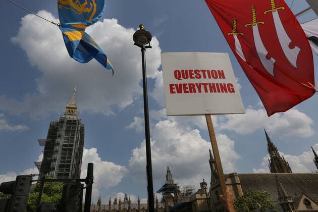 July 21, 2021, London, United Kingdom: A placard that questions trusting the government seen during the demonstration..English weather forecaster, businessman, activist, Piers Corbyn with other protesters met outside the House of Commons at Parliament Square to protest against Vaccine passports and other Coronavirus restrictions that he feels the public are being softened up to accept as the new normal. London United Kingdom - ZUMAs197 20210721_zaa_s197_221 Copyright: xMartinxPopex