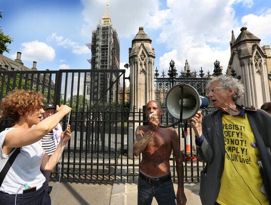 July 21, 2021, London, United Kingdom: Piers Corbyn shouts through a megaphone, during the demonstration..English weather forecaster, businessman, activist, Piers Corbyn with other protesters met outside the House of Commons at Parliament Square to protest against Vaccine passports and other Coronavirus restrictions that he feels the public are being softened up to accept as the new normal. London United Kingdom - ZUMAs197 20210721_zaa_s197_225 Copyright: xMartinxPopex