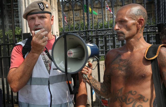 July 21, 2021, London, United Kingdom: Former soldier Nick Trotsky, wearing an elite forces beret speaks through a megaphone, during the demonstration..English weather forecaster, businessman, activist, Piers Corbyn with other protesters met outside the House of Commons at Parliament Square to protest against Vaccine passports and other Coronavirus restrictions that he feels the public are being softened up to accept as the new normal. London United Kingdom - ZUMAs197 20210721_zaa_s197_230 Copyright: xMartinxPopex