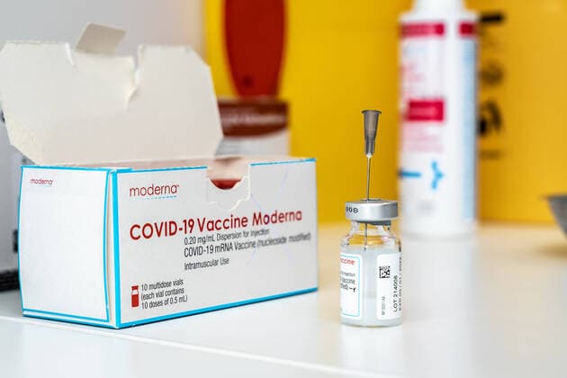 Augsburg, Bavaria, Germany - 16 july 2021: covid-19 vaccine Moderna vial with a syringe in a laboratory