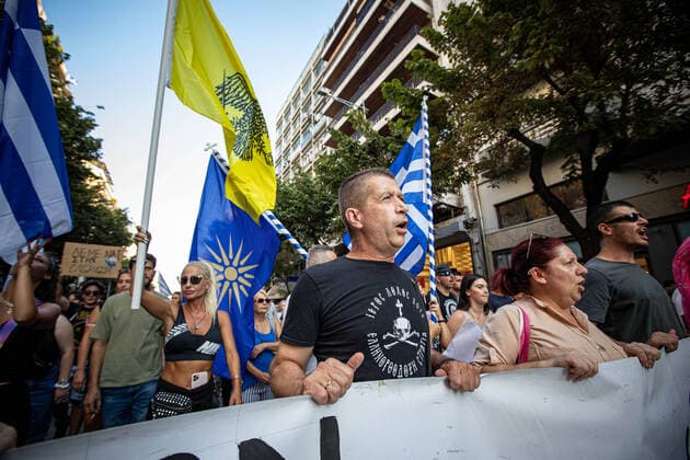 Demonstration Against The Mandatory Vaccine In Thessaloniki Protesters chanting the National Hymn of Greece. Demonstration Against The Mandatory Vaccine was held in Thessaloniki and Athens in Greece on Wednesday July 21, 2021. One week after the massive protest against the mandatory vaccination the anti-vaxx campaign continues with a big group protesting in the streets of the city of Thessaloniki. The protest was organized via social media by anti-vaccination believers. According to the group more than 40.000 people participated, while the police estimated unofficially slightly around 15.000 people participating in the demonstration. As the Greek government is passing a legislation with mandatory vaccination to specific job sectors like me  Copyright: xNicolasxEconomoux