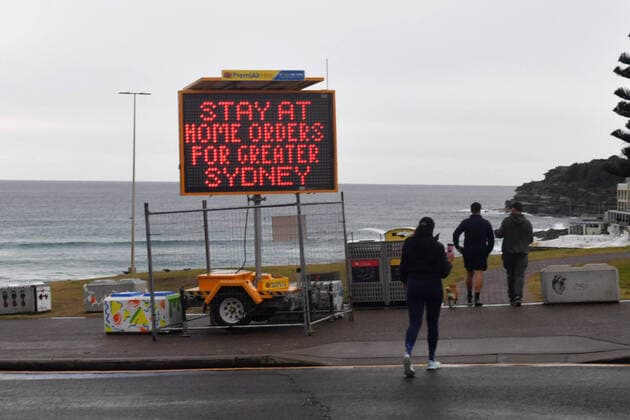 NSW CORONAVIRUS COVID19, A Covid warning sign is seen at Bondi Beach in Sydney, Friday, July 23, 2021. The stay-at-home orders for coronavirus-hit Greater Sydney and surrounds have been tightened with non-essential retail to close and all construction paused until July 30.( NO ARCHIVING, EDITORIAL USE ONLY, NO USE IN BOOKS WITHOUT CONSENT SYDNEY NSW AUSTRALIA  Copyright: xMICKxTSIKASx 20210723001559306776