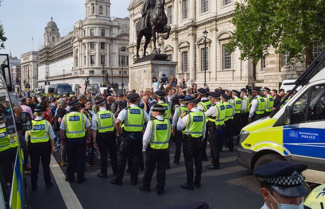 July 24, 2021, London, United Kingdom: Police block Whitehall during the demonstration..Thousands of protesters gathered in Westminster to protest against COVID-19 vaccinations, vaccine passports, and coronavirus restrictions, with many demonstrators calling the pandemic a hoax London United Kingdom - ZUMAs197 20210724_zaa_s197_209 Copyright: xVukxValcicx