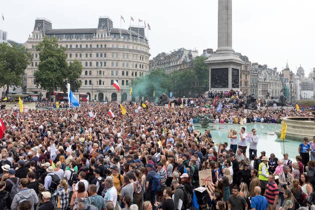 July 24, 2021, London, United Kingdom: Smoke bombs being blown off with in a crowd of protesters, during the ˜24th July Freedom Day London™ demonstration..The World Wide Rally for Freedom in London was part of a worldwide initiative to call for greater human rights protection in light of restrictions made over the pandemic. Specifically, protestors in London demanded no vaccine IDs and passports and medical freedom. The rally took place at Trafalgar Square. London United Kingdom - ZUMAs197 20210724_zaa_s197_219 Copyright: xBelindaxJlaox