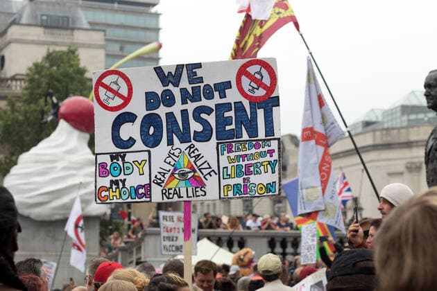 July 24, 2021, London, United Kingdom: An anti-lockdown protestor seen holding a placard that says we do not consent. my body my choice. during the ˜24th July Freedom Day London™ demonstration..The World Wide Rally for Freedom in London was part of a worldwide initiative to call for greater human rights protection in light of restrictions made over the pandemic. Specifically, protestors in London demanded no vaccine IDs and passports and medical freedom. The rally took place at Trafalgar Square. London United Kingdom - ZUMAs197 20210724_zaa_s197_220 Copyright: xBelindaxJlaox