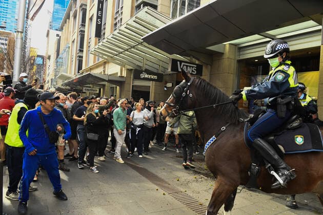 ANTI LOCKDOWN PROTEST SYDNEY, Protesters face off with mounted police at Sydney Town Hall during the ?World Wide Rally For Freedom? anti-lockdown rally at Hyde Park in Sydney, Saturday, July 24, 2021. ( NO ARCHIVING, EDITORIAL USE ONLY, NO USE IN BOOKS WITHOUT CONSENT SYDNEY NSW AUSTRALIA  Copyright: xMICKxTSIKASx 20210724001559664920