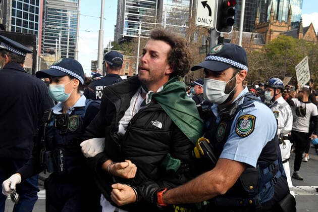 ANTI LOCKDOWN PROTEST SYDNEY, A protester is arrested by police at Sydney Town Hall during the ?World Wide Rally For Freedom? anti-lockdown rally at Hyde Park in Sydney, Saturday, July 24, 2021. ( NO ARCHIVING, EDITORIAL USE ONLY, NO USE IN BOOKS WITHOUT CONSENT SYDNEY NSW AUSTRALIA  Copyright: xMICKxTSIKASx 20210724001559665135