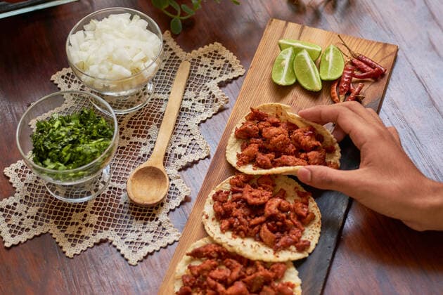 Authentic Mexican tacos on wooden table. Mexican gastronomy concept. Guadalajara, Jalisco, Mexico CR_UZKM210721-797802-01
