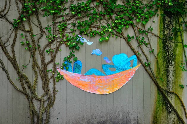 Summer dream in the city A paper collage depicting a person in a hammock , created by an anonymous hobby artist , now brings a great summer feeling to the often gray city life Munich Bavaria Germany Copyright: xRolfxPossx