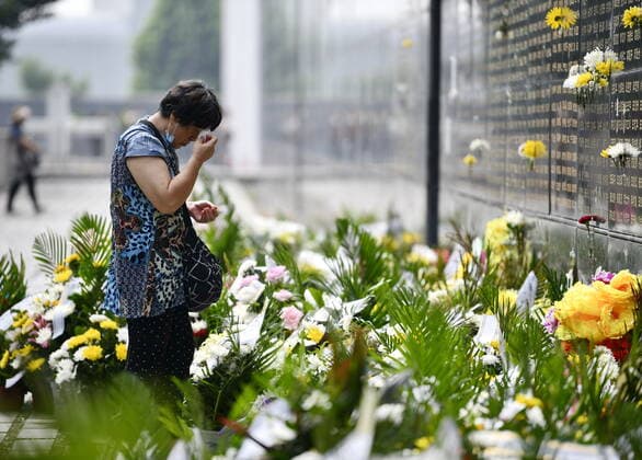 (210728) -- TANGSHAN, July 28, 2021 -- A woman mourns in front of a memorial wall at the Tangshan Earthquake Memorial Park in Tangshan, north China s Hebei Province, July 28, 2021. Wednesday marks the 45th anniversary of the Tangshan earthquake. The 7.8-magnitude quake struck the city of Tangshan in Hebei Province on July 28, 1976, killing more than 240,000 people and destroying virtually all buildings. (Photo by Xinhua) CHINA-HEBEI-TANGSHAN EARTHQUAKE-45TH ANNIVERSARY (CN) ZhaoxLiang 