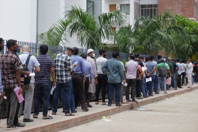July 28, 2021, Dhaka, Bangladesh: People stand in a queue as they wait for a Covid -19 coronavirus vaccine in front of a hospital in Dhaka. Dhaka Bangladesh - ZUMAh143 20210728_zap_h143_004 Copyright: xMDxMehedixHasanx