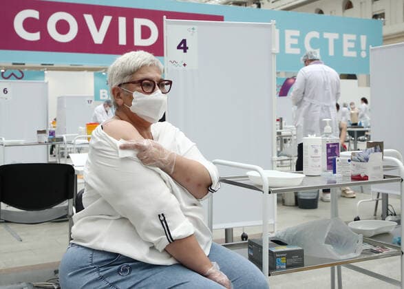 MOSCOW, RUSSIA - JULY 29, 2021: A woman visits the largest Russian COVID-19 vaccination site set up at the Gostiny Dvor Exhibition Centre, oncology patients also given injections. Anton Novoderezhkin TASS  TS10A40D