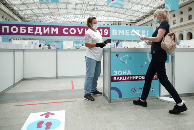 MOSCOW, RUSSIA - JULY 29, 2021: A woman visits the largest Russian COVID-19 vaccination site set up at the Gostiny Dvor Exhibition Centre, oncology patients also given injections. Anton Novoderezhkin TASS  TS10A41A