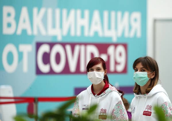 MOSCOW, RUSSIA - JULY 29, 2021: Volunteers work at the largest Russian COVID-19 vaccination site set up at the Gostiny Dvor Exhibition Centre, oncology patients also given injections. Anton Novoderezhkin TASS  TS10A41C