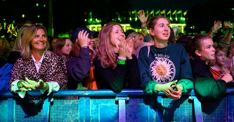 Audience to Danish Mads Bo Iversen, Phlake and Lasse Ziegler on guitar playing up to Havefest paa Plaenen in Tivoli on Friday 30 July 2021 Havefest replaces Fredagsrock, which has been canceled due to the Covid 19 Corona crisis,, Copenhagen  Copyright: TorbenxChristensen TorbenxChristensenx COP300 spdk20210731-014608-L