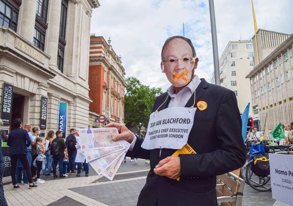 July 31, 2021, London, United Kingdom: A demonstrator dressed as Sir Ian Blachford holds fake money while standing outside the Science Museum during the anti-Shell sponsorship protest..Extinction Rebellion activists gathered once again outside the museum in South Kensington as part of their ongoing protest against oil giant Shell s sponsorship of the Our Future Planet climate change exhibition. London United Kingdom - ZUMAs197 20210731_zaa_s197_075 Copyright: xVukxValcicx