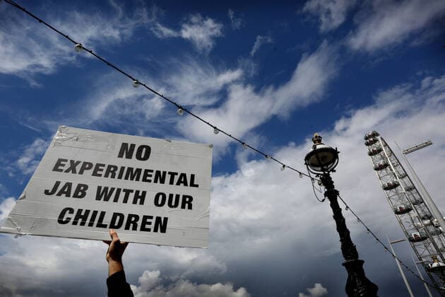 July 31, 2021, London, United Kingdom: A protester holds a placard during the demonstration..Children and their parents protest in Central London against continued Covid-19 restrictions and vaccination of children. London United Kingdom - ZUMAs197 20210731_zaa_s197_258 Copyright: xMartinxPopex