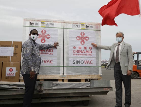 (210731) -- ZANZIBAR, July 31, 2021 -- Zanzibar s Minister of Trade and Industrial Development Omar Said Shaaban (L) and Chinese Consul General in Zanzibar Zhang Zhisheng attend the handover ceremony of the COVID-19 vaccines at the Abeid Amani Karume International Airport in Zanzibar, Tanzania, on July 31, 2021. Tanzania s Zanzibar on Saturday received a batch of Sinovac COVID-19 vaccines and syringes donated by China. (Photo by Xinhua) TANZANIA-ZANZIBAR-CHINA-COVID-19 VACCINE-DONATION HermanxEmmanuel 