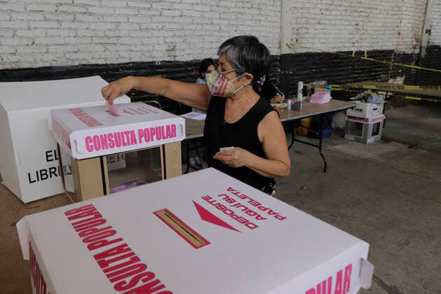 First Popular Consultation In Mexico A woman casts her vote at a ballot box installed in Colonia El Vergel, Iztapalapa, during the First Popular Consultation in Mexico, where citizens were asked whether they agree or disagree with the possibility of initiating criminal proceedings against past rulers, whose participation process was organised by the National Electoral Institute. Mexico City Mexico vieyra-notitle210801_np6ZC  Copyright: xGerardoxVieyrax