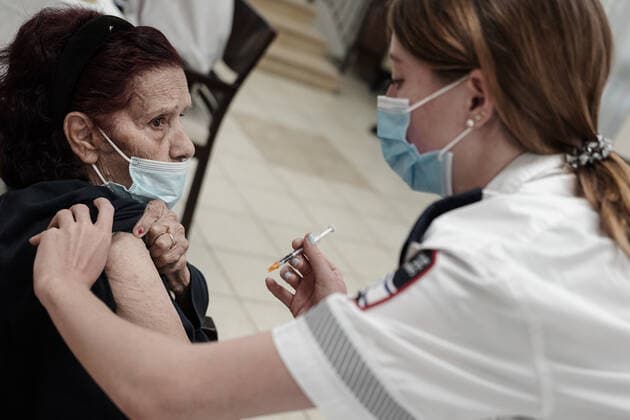August 2, 2021, Jerusalem, Israel: Paramedics from Magen David Adom, serving as the Israeli Red Cross organization and leading EMS, deliver a 3rd BioNTech Pfizer booster vaccine to seniors at the Mishan Gonen Assisted Living Residence for the elderly. PM Bennett announced his goal of vaccinating all Israeli seniors, 60 and above, with a 3rd vaccine by the end of August 2021, in spite of the fact that a booster shot has not yet been approved by the US FDA. Jerusalem Israel - ZUMAa126 20210802_zap_a126_012 Copyright: xNirxAlonx