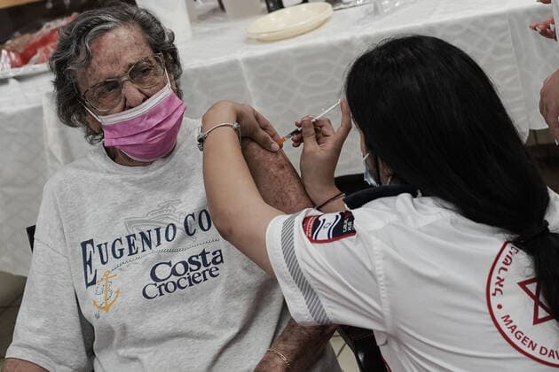 August 2, 2021, Jerusalem, Israel: Paramedics from Magen David Adom, serving as the Israeli Red Cross organization and leading EMS, deliver a 3rd BioNTech Pfizer booster vaccine to seniors at the Mishan Gonen Assisted Living Residence for the elderly. PM Bennett announced his goal of vaccinating all Israeli seniors, 60 and above, with a 3rd vaccine by the end of August 2021, in spite of the fact that a booster shot has not yet been approved by the US FDA. Jerusalem Israel - ZUMAa126 20210802_zap_a126_019 Copyright: xNirxAlonx
