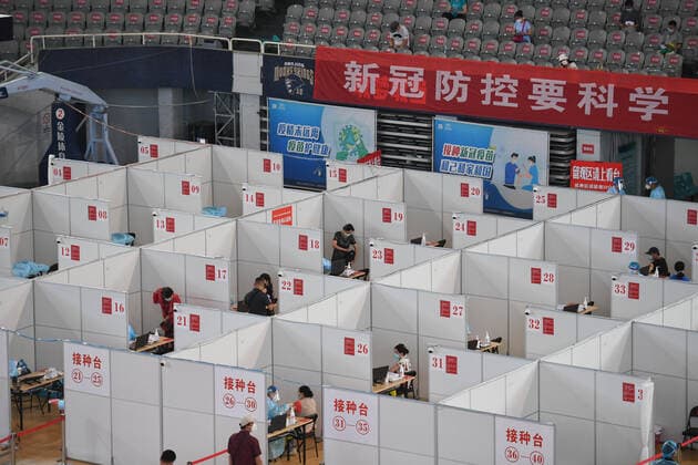 (210802) -- NANJING, Aug. 2, 2021 -- Residents get inoculated against the COVID-19 virus at a vaccination site in a stadium in Nanjing, capital of east China s Jiangsu Province, Aug. 2, 2021. The city of Nanjing has been organizing vaccinations from Sunday for those who are qualified to get the second shot in low-risk areas amid resurgence of COVID-19 infections. ) CHINA-JIANGSU-NANJING-COVID-19-VACCINATION (CN) JixChunpeng 