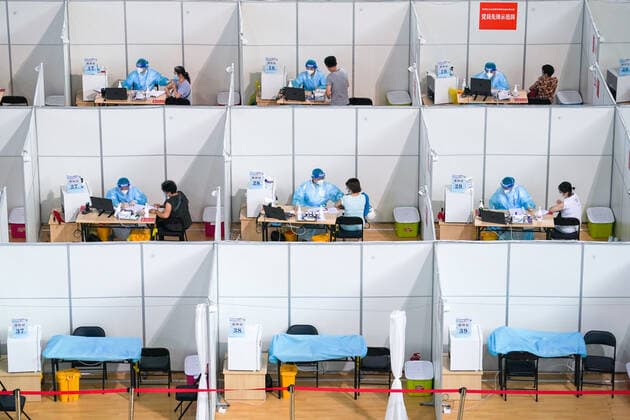 (210802) -- NANJING, Aug. 2, 2021 -- Residents get inoculated against the COVID-19 virus at a vaccination site in a stadium in Nanjing, capital of east China s Jiangsu Province, Aug. 2, 2021. The city of Nanjing has been organizing vaccinations from Sunday for those who are qualified to get the second shot in low-risk areas amid resurgence of COVID-19 infections. ) CHINA-JIANGSU-NANJING-COVID-19-VACCINATION (CN) LixBo