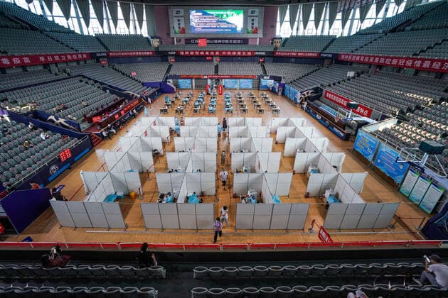 (210802) -- NANJING, Aug. 2, 2021 -- Residents get inoculated against the COVID-19 virus at a vaccination site in a stadium in Nanjing, capital of east China s Jiangsu Province, Aug. 2, 2021. The city of Nanjing has been organizing vaccinations from Sunday for those who are qualified to get the second shot in low-risk areas amid resurgence of COVID-19 infections. ) CHINA-JIANGSU-NANJING-COVID-19-VACCINATION (CN) LixBo 