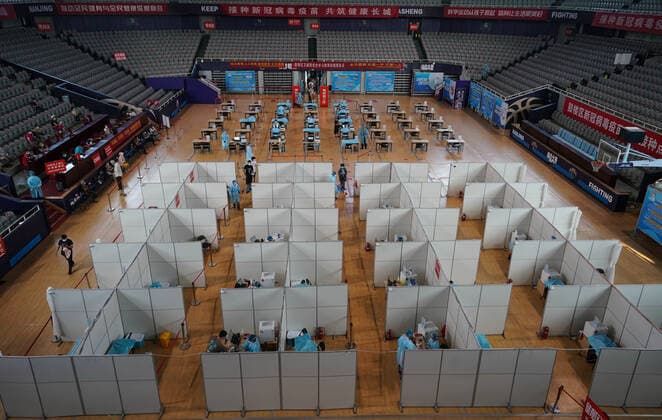 (210802) -- NANJING, Aug. 2, 2021 -- Residents get inoculated against the COVID-19 virus at a vaccination site in a stadium in Nanjing, capital of east China s Jiangsu Province, Aug. 2, 2021. The city of Nanjing has been organizing vaccinations from Sunday for those who are qualified to get the second shot in low-risk areas amid resurgence of COVID-19 infections. ) CHINA-JIANGSU-NANJING-COVID-19-VACCINATION (CN) JixChunpeng 