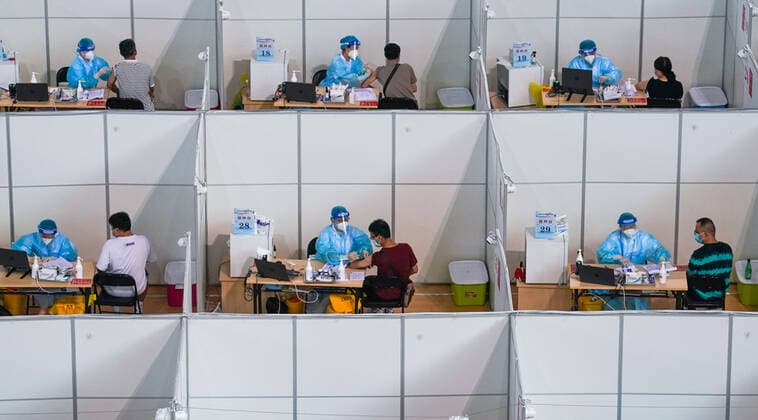 (210802) -- NANJING CHANGSHA, Aug. 2, 2021 -- Residents get inoculated against the COVID-19 virus at a vaccination site in a stadium in Nanjing, capital of east China s Jiangsu Province, Aug. 2, 2021. ) Xinhua Headlines: China goes all out to contain Delta outbreak LixBo 