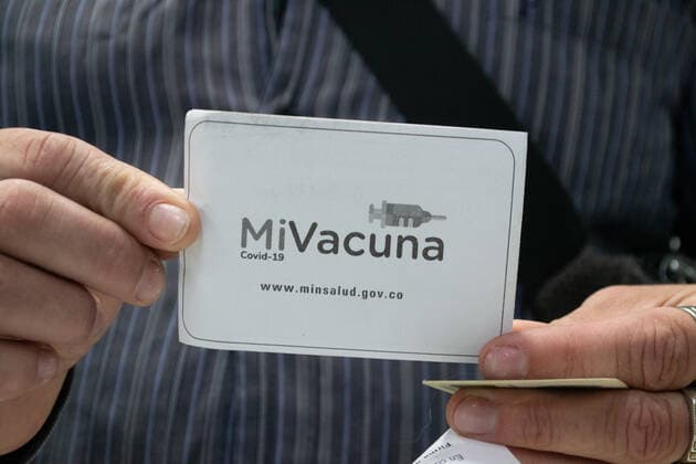 August 2, 2021, Bogota, Cundinamarca, Colombia: A person vaccinated holds the Mi Vacuna vaccination documentation given to Colombian citizens as public transport drivers and people from ages 25 to 30 start their vaccination phase with the Moderna novel COVID-19 vaccine against the Coronavirus disease in Bogota, Colombia on August 2, 2021. Bogota Colombia - ZUMAvp1_ 20210802_zia_vp1_010 Copyright: xMartinxGalindox