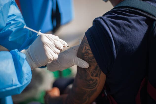 Moderna COVID-19 Vaccination In Colombia A men with a cat tattoo gets vaccinated against COVID-19 during a mass vaccination to people from ages 25 to 30 against the novel Coronavirus disease in Bogota, Colombia with the Moderna and the Pfizer and BioNtech vaccines against COVID-19 on August 2, 2021. Bogota Cundinamarca Colombia barrossalamanca-modernac210802_npz56  Copyright: xSebastianxBarrosx