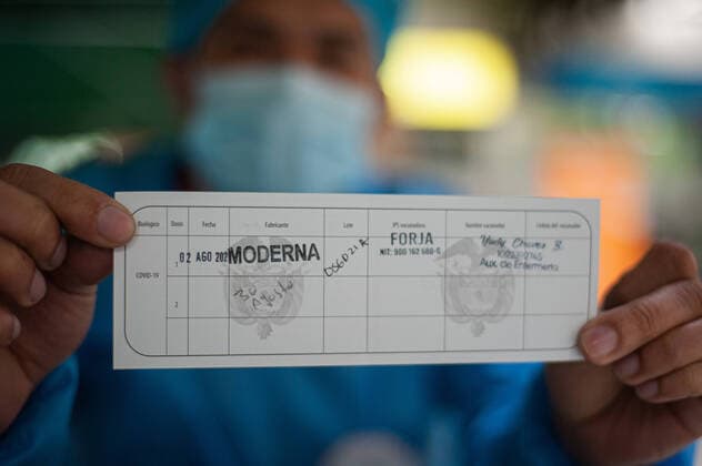 Moderna COVID-19 Vaccination In Colombia A nurse holds on his hands the Mi Vacuna document with the date and name of the vaccine applied that certificate Colombian citizens from being vaccinated against COVID-19 during a mass vaccination to people from ages 25 to 30 against the novel Coronavirus disease in Bogota, Colombia with the Moderna and the Pfizer and BioNtech vaccines against COVID-19 on August 2, 2021. Bogota Cundinamarca Colombia barrossalamanca-modernac210802_npzih  Copyright: xSebastianxBarrosx