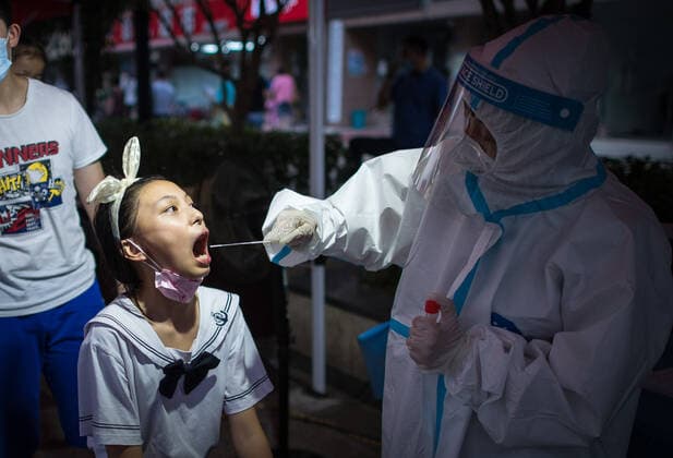 (210803) -- WUHAN, Aug. 3, 2021 -- A medical worker takes a swab sample from a resident for COVID-19 nucleic acid testing in Wuhan, central China s Hubei Province, Aug. 3, 2021. Wuhan City, capital of central China s Hubei Province, launched another citywide COVID-19 nucleic acid testing campaign on Tuesday, according to a press conference held by the provincial COVID-19 prevention and control headquarters. Wuhan, once hard-hit by COVID-19, identified new local clusters of cases on Monday when seven migrant workers at the Wuhan Economic & Technological Development Zone tested positive for the coronavirus. ) CHINA-HUBEI-WUHAN-COVID-19-TESTING (CN) XiaoxYijiu