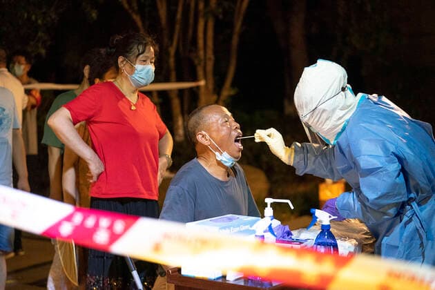 (210803) -- WUHAN, Aug. 3, 2021 -- A medical worker takes a swab sample from a resident for COVID-19 nucleic acid testing in Wuhan, central China s Hubei Province, Aug. 3, 2021. Wuhan City, capital of central China s Hubei Province, launched another citywide COVID-19 nucleic acid testing campaign on Tuesday, according to a press conference held by the provincial COVID-19 prevention and control headquarters. Wuhan, once hard-hit by COVID-19, identified new local clusters of cases on Monday when seven migrant workers at the Wuhan Economic & Technological Development Zone tested positive for the coronavirus. ) CHINA-HUBEI-WUHAN-COVID-19-TESTING (CN) XiongxQi