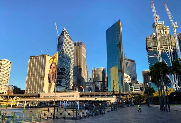 (210804) -- SYDNEY, Aug. 4, 2021 -- People walk on an empty street in Sydney, Australia, Aug. 4, 2021. As of Tuesday afternoon, there had been 34,833 confirmed cases of COVID-19 in Australia, and the number of locally acquired cases in the previous 24 hours was 219, according to the latest figures from the Department of Health. Recently, the country s most populous city of Sydney in the state of New South Wales (NSW), continued to battle the outbreak of COVID-19 triggered by the Delta variant. ) AUSTRALIA-SYDNEY-COVID-19-CASES BaixXuefei