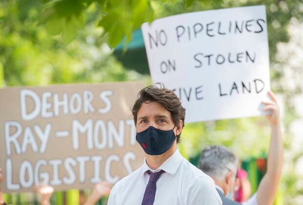 August 5, 2021, Montreal, PQ, Canada: Prime Minister Justin Trudeau is shown during a childcare funding announcement as protesters hold up signs in Montreal, Thursday, August 5, 2021. Montreal Canada  - ZUMAc35_ 20210805_zaf_c35_051 Copyright: xGrahamxHughesx