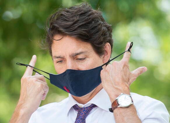 August 5, 2021, Montreal, PQ, Canada: Prime Minister Justin Trudeau removes his mask during a childcare funding announcement in Montreal, Thursday, August 5, 2021. Montreal Canada  - ZUMAc35_ 20210805_zaf_c35_053 Copyright: xGrahamxHughesx