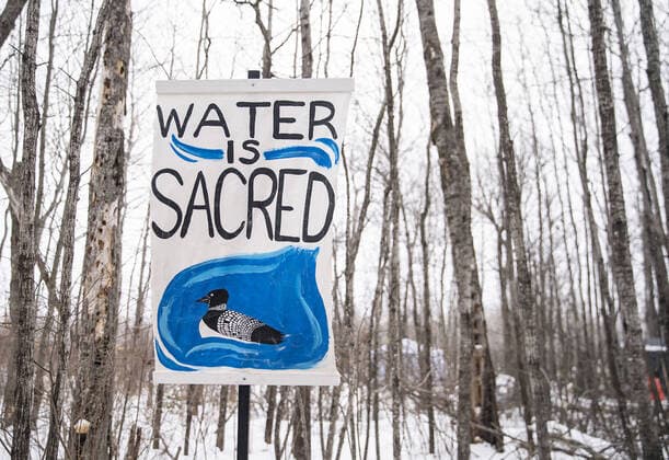February 17, 2021, Cloquet, MN, USA: Signs are posted outside Camp Migizi, a small encampment of mostly indigenous water and land protectors located right beside the Enbridge Line 3 construction site on the Fond Du Lac Native American reservation in Cloquet, Minnesota. Cloquet USA - ZUMAm67_ 20210217_zaf_m67_042 Copyright: xAlexxKormannx